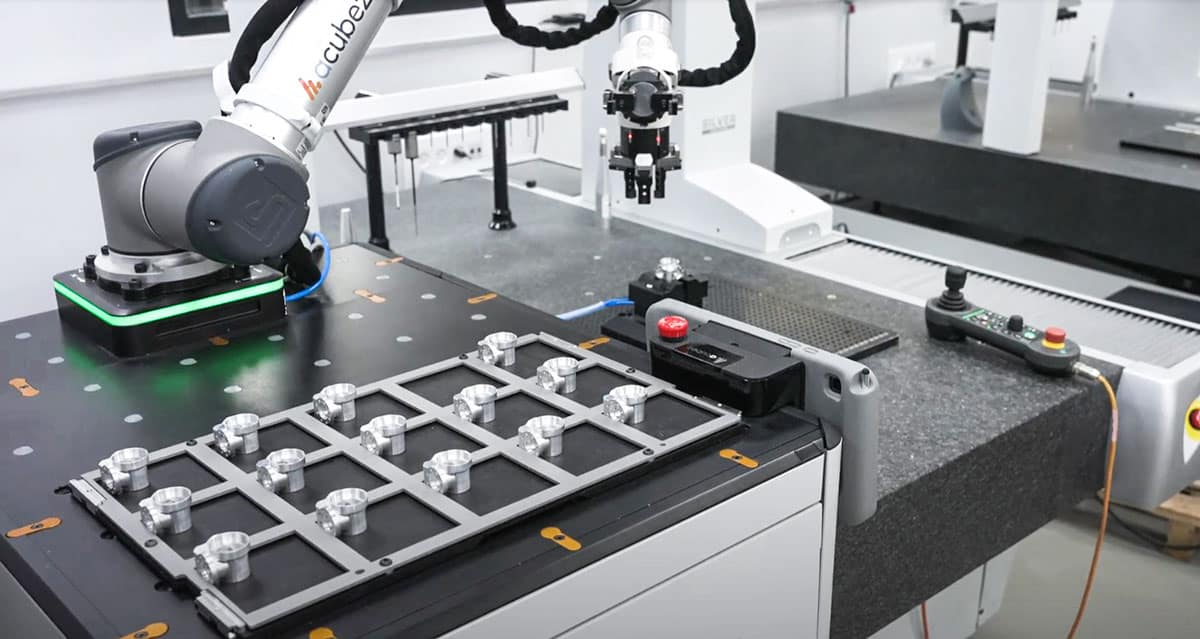 Automated CMM machine: Acubez™ 3-finger gripper placing finished workpiece for measurement inspection