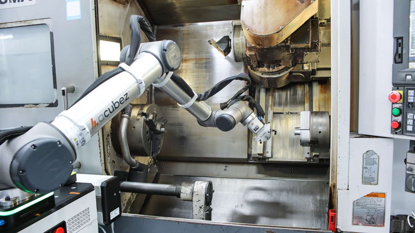 Automated CNC Okuma Milling machine: Acubez™ end of arm tooling loading clamp